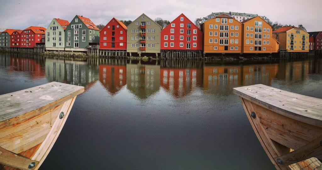 colorful row houses on water in Trondheim, Norway European city 